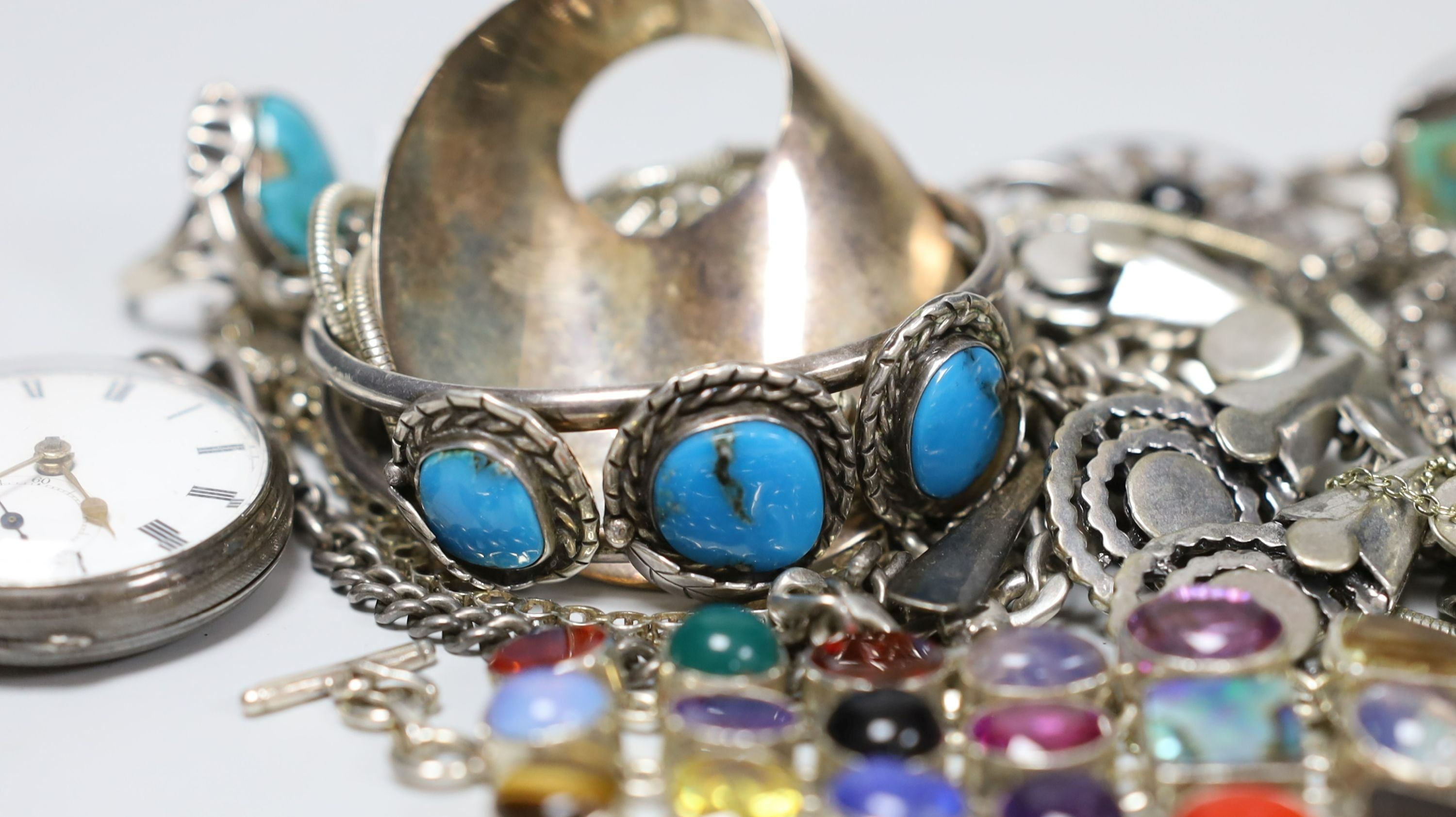 A quantity of assorted silver and white metal jewellery etc. including albert chain with pocket watch, bangles, bracelets, brooches, money clip and rings.